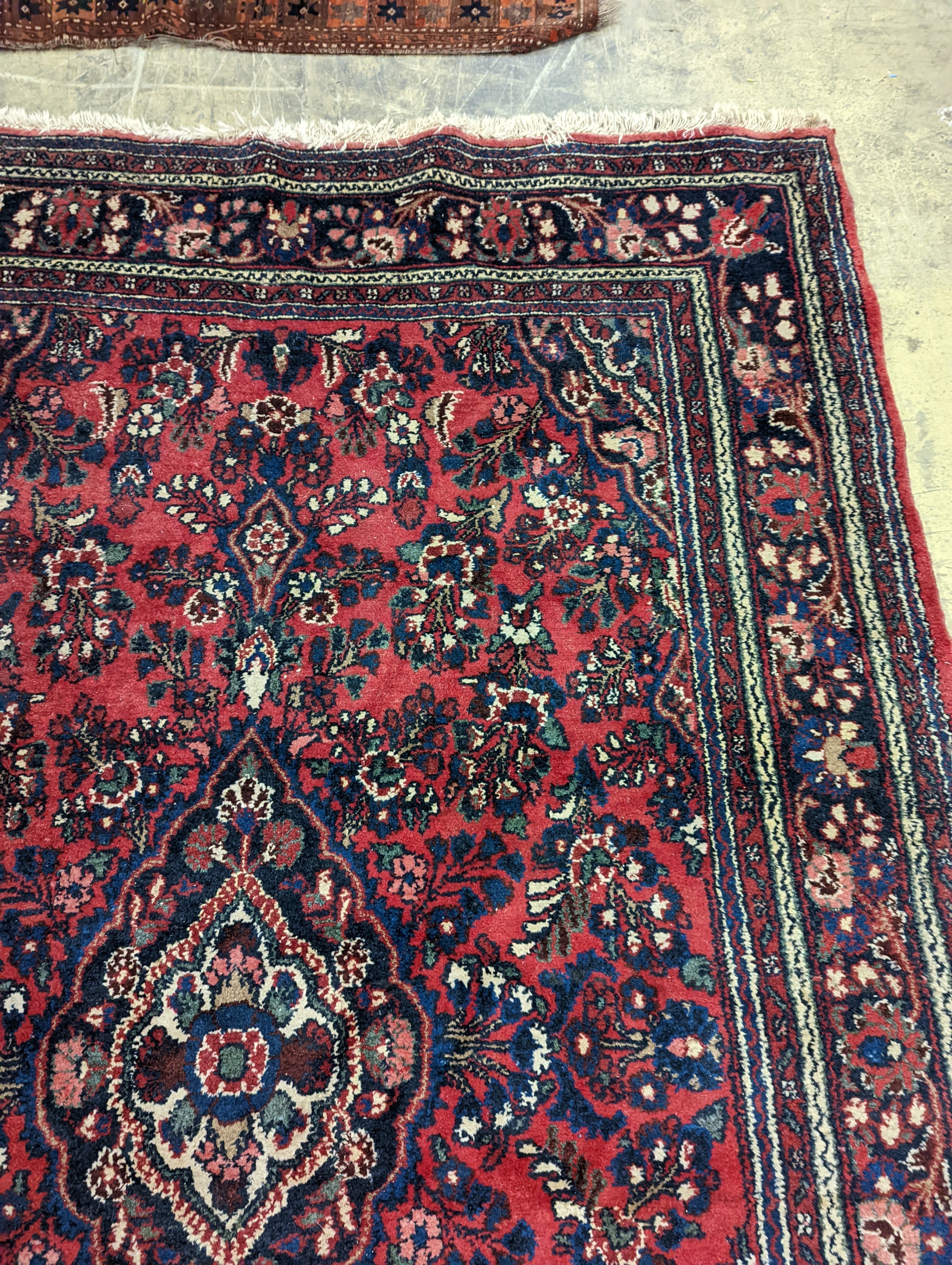 A Tabriz style red ground carpet, 290 x 190cm
